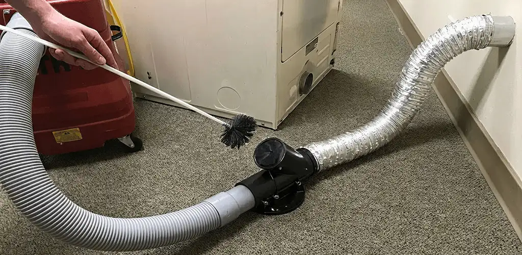 Dryer vent cleaning service removing lint from a dryer duct connection in Albuquerque, NM