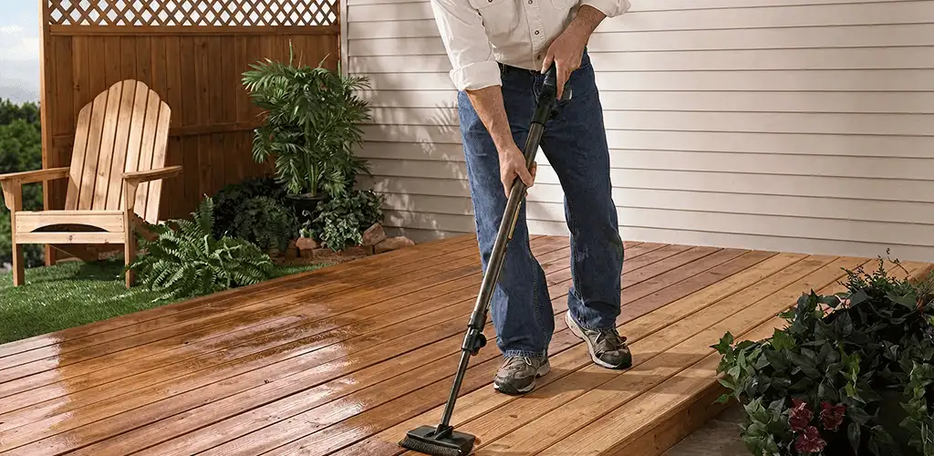 Deck staining service applying stain to a backyard wood deck in Albuquerque, NM
